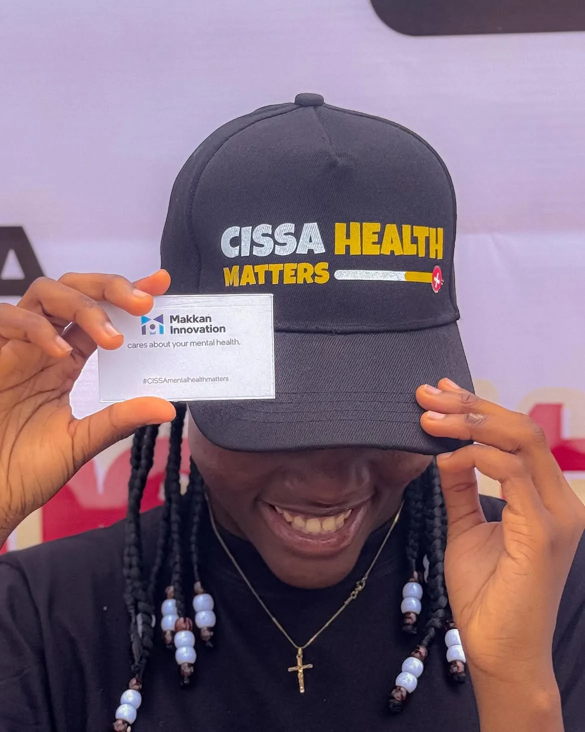 A CISSA Health Matters cap alongside a Makkan Innovation mental health awareness card.